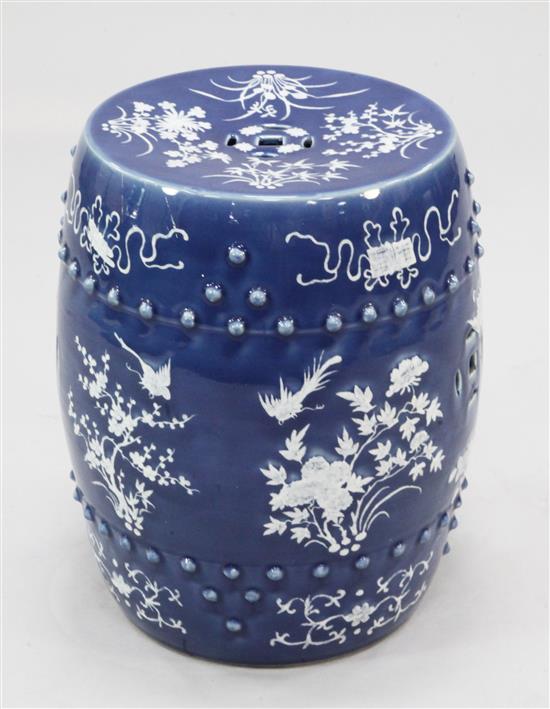 A Chinese blue ground white slip decorated barrel shaped garden seat, late 19th century, 46.5cm